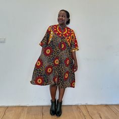 The sunrise dress is perfect to add fun to your wardrobe. Our loose fit colourful dresses made out of non-stretchy African print are perfect for you in case you are looking for a style idea that is versatile, comfortable, and looks fabulous year-round. All materials used to design the dresses are sourced in Kenya.  MEASUREMENT GUIDE:  We recommend asking questions about sizes or you can take your own measurements (at the bust) if unsafe. Since its an A- Line, you only need to ensure that you hav Red Ankara Fabric Short Sleeve Dress, Knee-length Ankara Fabric Dress, Kitenge Dress, Africa Dress, Kente Dress, Ankara Gowns, Kitenge, Ankara Dress, Ankara