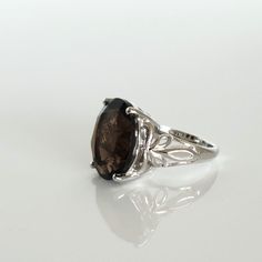 A Fashion Statement Solitaire Ring. The Big Brazilian Smoky Quartz Gemstone Weighs 8.5 Carats. The Quartz Gemstone Is Oval 16x12 Mm Faceted. The Ring Is Platinum Bond Brass. New Without Tags. Gift Box Included. Smokey Quartz Ring, Smoky Quartz Ring, Quartz Ring, Smokey Quartz, Smoky Quartz, Solitaire Ring, Fashion Statement, Platinum, Gift Box