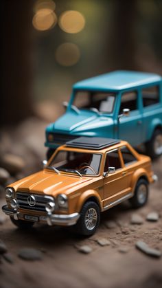 two toy cars sitting on top of each other in front of a blue van and brown car