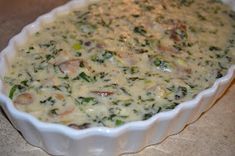 a casserole dish filled with broccoli and cheese