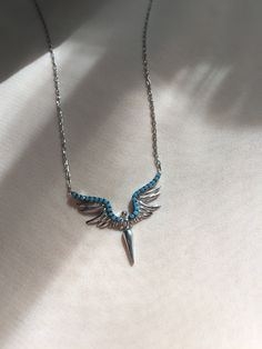 "Handcrafted in 925 sterling silver, our timeless and best selling \"Angel Pendant Necklace has Turquoise Gemstone version now!  Universally wearable, timelessly charming...Layer or wear individually!  This Silver Angel Pendant is crafted into the shape of an angel with wings signifying faith, devotion, hope, trust and love. The Turquoise Angle Necklace is skin-friendly and hypoallergenic, handcrafted from 925 sterling silver. The materials used are high quality and durable. The finish of this delicate angel gemstone jewelry is also silver. This beauty does not need a full stack, it is super pretty all by itself! You can wear it individually or as a layered necklace. This angel necklace is the perfect gift for a loved one, best friends, bridesmaids, sisters or mum on special occasions. As Fine Jewelry Sterling Silver Turquoise Necklaces, Fine Jewelry Sterling Silver Necklaces In Turquoise, Turquoise Gemstone Necklace In Sterling Silver, Sterling Silver Hallmarked Turquoise Jewelry, Elegant Sterling Silver Turquoise Necklace, Turquoise Necklace With Sterling Silver Clasp As Gift, Turquoise Sterling Silver Fine Jewelry, Sterling Silver Turquoise Gemstone Necklace Gift, Turquoise Sterling Silver Necklace