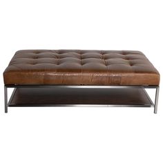 a brown leather ottoman sitting on top of a metal frame table with a shelf underneath it