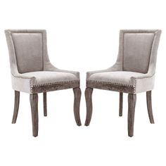 a pair of gray chairs sitting next to each other