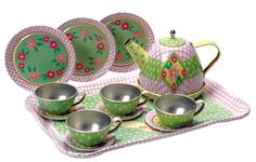 a green tea set with matching cups and saucers