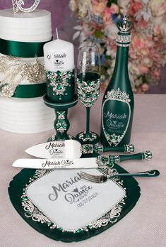 a table topped with two cakes and wine glasses