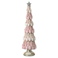 a pink and white christmas tree with stars on top