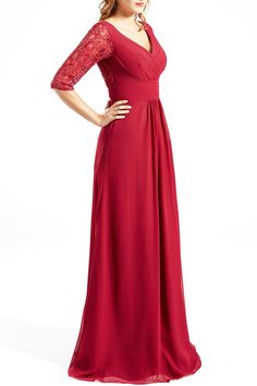 a woman in a long red dress posing for the camera with her hands on her hips