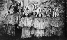 an old black and white photo of women in native garb