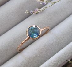 A Simple Dainty Ring features a Genuine 0.83ct Round Faceted Blue Sapphire set in a minimalist bezel setting handcrafted in 9k Solid Rose Gold. Our beautiful Blue Sapphire with it's exquisite Blue Hue and Sparkle will have her swooned especially since it is One-Of-A-Kind making it a special Promise/Engagement/Anniversary/September Birthstone Ring for her. It comes with a Ring Box ready for gift-giving. Sapphire Ring Info ---------------------- Solid 9k Rose Gold Genuine Natural Round Facet Blue Sapphire 0.83ct, 5mm Sapphire with Bezel 6.4mm Band Width 1.1mm Protrudes off of the finger 4mm Customizable ------------------------ We can customize the ring using your choice of center stone, accent stone, metal, design, etc.  We can also handcraft a nesting band to pair with the ring, just convo Blue Sapphire Promise Ring, Glamour Jewelry, September Birthstone Ring, Ring Blue Sapphire, Beautiful Wedding Bands, September Birthstone Rings, Promise Ring For Her, Zierlicher Ring, Bezel Ring