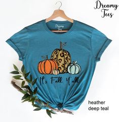 It's Fall Y'all Shirt, Fall Shirt, Pumpkin Shirt , Cute Fall Tshirt, Fall Mom Shirt, Fall Teacher Shirt, Women's Fall Shirt, Gift For Her--- SIZING AND COLOR ---Listing photos contain colors and measurements for both women's v-neck and unisex crew neck shirts. Please be careful of which style you select from the drop down menu and double-check your measurements to make sure you order the proper size all since we do not offer returns/exchanges. We make each shirt to order and all sales are final. Blue Letter Print T-shirt For Fall, Fall Funny Print Short Sleeve Tops, Blue Screen Print T-shirt For Fall, Blue T-shirt With Screen Print For Fall, Blue Graphic Tee For Fall, Funny Print Short Sleeve Tops For Fall, Fall Blue Shirt With Letter Print, Blue Letter Print Shirt For Fall, Blue Shirt With Letter Print For Fall