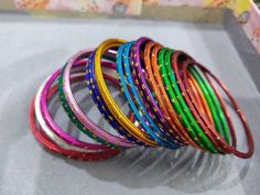 Welcome to our shop We bring to you very ethnic products from core of India almost every thing is handmade or custom made Set of 22 Bangles in multiple colors Size 2.4 We will be happy to serve you Handmade Pink Bracelets For Festive Occasions, Handmade Pink Bracelets For Festive Season, Handmade Pink Festive Bracelets, Multicolor Round Beads Bangle For Festival, Traditional Multicolor Bangle With Round Beads, Multicolor Stackable Jewelry For Festival, Multicolor Stackable Festival Jewelry, Traditional Adjustable Multicolor Bangle, Bohemian Multicolor Stackable Bangle