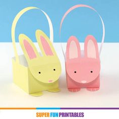 two paper bunny bags sitting next to each other