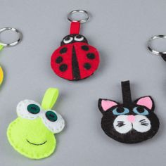 four keychains made to look like ladybug, cat, and frog