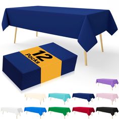 a table covered in blue, yellow, and purple cloths next to each other