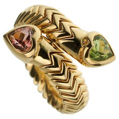 This exquisite vintage Bvlgari Spiga ring is a masterful blend of luxurious materials and iconic design, making it a standout piece in any jewelry collection. Crafted from rich 18k yellow gold, the ring showcases Bvlgari's signature Spiga pattern, characterized by its intricate, interwoven design that evokes the look of braided wheat, symbolizing prosperity and continuity. Vintage Bvlgari, Bulgari Jewelry, Yellow Gold Cocktail Ring, Bvlgari Jewelry, Luxury Jewelry Brands, Zigzag Pattern, Family Jewels, Gold Cocktail Ring, Gold Cocktail