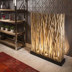 a living room filled with furniture next to a wall mounted radiator and bookshelf