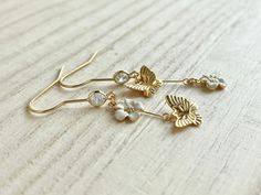 These dainty butterfly earrings with flowers are made of the followings: (1) Matt gold plated butterfly charm (Size: 8 x 10mm) (2) gold plated enamel flowers charm (size: 9 x 8mm) (3) gold plated earring hooks with cubic zirconia The total length of the earrings is about 47mm. ✏️ Please choose your desired color of flower 【BEFORE PURCHASE, PLEASE NOTE THE FOLLOWINGS】 ☆ VAT, GST and any other taxes from your country are NOT included in the listing price. Buyers are responsible for any aforesaid t White Butterfly Charm Earrings For Wedding, Dainty Butterfly Earrings For Wedding, White Dainty Butterfly Earrings, Dainty White Butterfly Earrings, Ring Charm Necklace, Dainty Butterfly, January Birthstone Rings, Baby Rings, Butterfly Jewelry