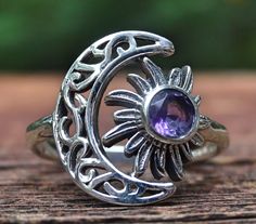 ☾Handmade, Natural Amethyst Sterling Silver Detailed Moon & Sun Ring Size 6.5☾ ❤︎Featured in this listing is a sterling silver, handmade, natural stone ring. This lovely ring features a beautiful, Natural Purple Amethyst Moon round stone. The round Amethyst gemstone has been bezel set into Sun within a handmade, detailed Crescent Moon Ring setting. ❤︎Highly polished smooth 2mm band, with the size of the detailed moon at 16x14mm ❤︎100% Natural untreated stone Stone: Natural Amethyst (5mm) Metal: Celestial Purple Round Jewelry, Purple Celestial Round Jewelry, Mystical Silver Amethyst Ring, Silver Amethyst Moon Phase Jewelry, Celestial Amethyst Moon Phase Jewelry, Celestial Moon Phase Amethyst Jewelry, Silver Amethyst Jewelry With Moon Phase, Bohemian Amethyst Sterling Silver Ring, Bohemian Amethyst Crystal Ring