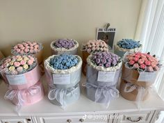 a bunch of flowers that are sitting on a table