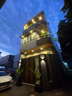 an apartment building with lights on at night