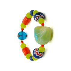 If you want a vibrant pop of color to your style, Color of Life Bracelet is the ideal choice for you. This fun design features African beads, green and blue jade stone beads, Nepal beads and an evil eye bead for protection and good luck. This unique piece would make the perfect gift for yourself or a loved one. The Evil Eye is a prominent symbol in Turkish and many other cultures, and is highly protective. Evil Eye beads reflect ill intent and jealousy back to the person thinking of it, hence pr Summer Bracelets, Blue Evil Eye, African Beads, Jade Stone, Personalized Accessories, Green Bead, Color Of Life, Blue Beads, Bracelet Sizes