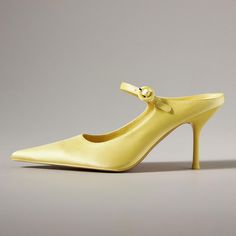 Add a pop of color with these yellow pointed toe stiletto heel mules featuring a stylish buckled strap for a touch of sophistication and flair. Perfect for chic, statement-making looks. Color: Yellow Heel Type: Stiletto heel Heel Height: 3.5'' / 89 mm approx Product measurements were taken using size 8. Please note that measurements may vary by size. Toe: Pointed toe Buckled strap design Handcrafted US sizing. Fits true to size. Summer Heels With Buckle Closure And Pointed Toe, Trendy Pointed Toe Heels With Buckle Closure, Pointed 4-inch Heels For Summer, Pointed 4-inch Kitten Heels For Spring, Spring Pointed 4-inch Kitten Heels, Yellow Pointed Toe Slingback Pumps For Summer, Pointed Heels With Heel Strap For Spring, Spring Pointed Heels With Heel Strap, Summer Kitten Heels With Buckle Closure And Pointed Toe