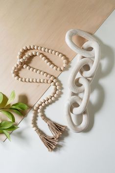 PRICES MAY VARY. [BEAUTIFUL DECOR WITH GREAT QUALITY] These beautiful handcrafted wood links and bead garland set makes a great accent to your home! They pair nicely with modern farmhouse, boho or traditional home decor style! They look amazing draped over books, trays on a table or shelf. Made of beautiful natural pine wood, each link is carefully hand carved. With the unique natural differences in wood, no two items will look exactly the same. Each piece will have its own unique appearance and Boho Decorations, Decorations For Living Room, Decor Modern Farmhouse, Neutral Fall Decor, Amazon Decor, Chain Decor, Wooden Bead Garland, Boho Room Decor, Country Decor Rustic