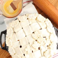 a pie sitting on top of a wooden cutting board