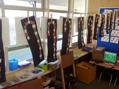 an office decorated for christmas with paper streamers