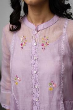 Pastel lilac kurta with all-over floral embroidery, lace detailing, mandarin collar and button placket. Comes with pant and inner slip.
Component: 3
Embroidered
Neckline: Mandarin Collar
Sleeve Length: Three Quarter
Fabric: Kurta: Chanderi Pant and Inner Slip: Cotton
Color: Purple
Gathers at the side
Asymmetric hem
Lace trim sleeves and straight fit pant - Aza Fashions Traditional Lace Trim Set For Spring, Traditional Spring Sets With Lace Trim, Fitted Lavender Embroidered Sets, Embroidered Fitted Lavender Sets, Purple Sets With Floral Embroidery, Lavender Sets With Resham Embroidery, Fitted Sets With Embroidered Border For Spring, Spring Embroidered Lace Set, Spring Embroidered Purple Sets