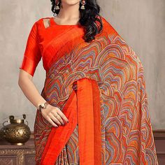 Orange colored saree is made from chiffon fabric which is highlighted with beautiful printed work as shown. Comes along with unstitched chiffon blouse piece which you can customise as per your design/style. Occasion - You can wear this saree for casual and daily wear. Note:- the actual product may differ slightly in color and design from the one illustrated in the images when compared with computer or mobile screen. Measurements: Saree : Chiffon : 5.5 Mtrs Blouse : Chiffon : 0.8 Mtr Material: Chiffon Stitch Type: Unstitched Country of Origin: India Care Guide: Dry Clean