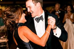 a man and woman dancing together at a wedding