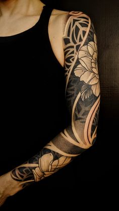 a woman with a tattoo on her arm