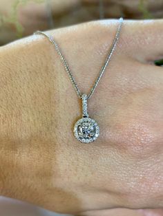 Metal: 14kt White Gold Stone: Diamond Shape: Round Diamond Halo Weight: .13ctw Diamond Center Weight: .51ctw Weight of entire piece with chain: 3.20 grams Type of Chain: 1.00mm Diamond-cut Wheat Chain Length Of Chain: 16 inches Length Of Pendant Including Bail: 16 mm Brilliant Cut Pendant Diamond Necklace In Fine Jewelry Style, Fine Jewelry Diamond Necklace With Halo Setting, Fine Jewelry Diamond Pendant Necklace With Halo Setting, Round Fine Jewelry With Pave Setting, Brilliant Cut Pendant Diamond Necklace, Fine Jewelry With Pave Setting, Classic Round Diamond Necklace With Halo Design, Round Diamond Solitaire Necklace With Halo Design, Anniversary Diamond Necklace In White Gold With Halo Design