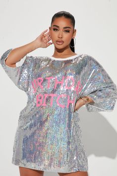 Available In Silver. Sequin T-Shirt Dress Ribbed Collar 'Birthday Bitch' Verbiage Lined Slight Stretch 100% Polyester Imported | Birthday Sequin Mini Dress in Silver by Fashion Nova Short Sleeve Graphic Print Party Dress, Spring Party Tops With Text Print, Short Sleeve Graphic Print Dress For Party, Long Sleeve T-shirt For Party In Spring, Graphic Print Top For Party Season, Graphic Print Tops For Party Season, Long Sleeve T-shirt For Summer Party, Short Sleeve Top For Birthday Party, Short Sleeve Top For Birthday And Party Season