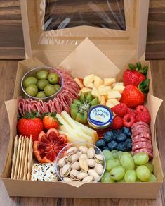 a box filled with assorted fruits and snacks