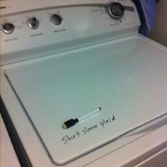 a dryer that is sitting on top of a stove with the words, keep a dry erase marker to note clothes inside the washer that shouldn't be dried