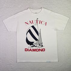 Diamond Supply Co. x Nautica Shirt Medium White Streetwear Skateboarding T-shirt Good Pre-owned Condition  Size: Medium  Color: White 100% Cotton Machine Washable  See photographs for MEASUREMENTS *To ensure the best fit, please measure the chest and total length of your favorite-fitting shirt and compare measurements to those of this particular item Same Day - Next Business Day Shipping This Diamond Supply Co. x Nautica shirt is a must-have for any streetwear or skateboard enthusiast. The white Nautical Cotton T-shirt With Graphic Print, Cotton Graphic Print Tops For Sailing, Sail Color Crew Neck T-shirt With Graphic Print, Graphic Print Crew Neck T-shirt For Sailing, Vintage Logo Print T-shirt, Crew Neck Graphic Print Top For Sailing, White Nautical Crew Neck T-shirt, Nautical White Crew Neck T-shirt, Nautical Style Cotton T-shirt With Graphic Print