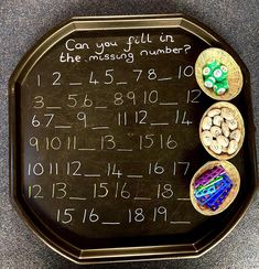 a black board with numbers and magnets on it that says can you fill in the missing numbers?