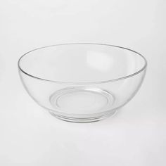 a clear glass bowl on a white background