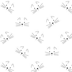 a black and white pattern with cats'faces on it, including one cat's head