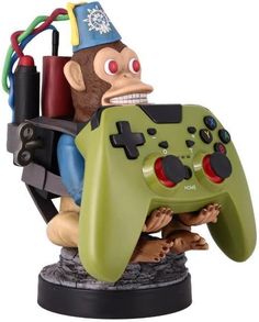 a statue of a man holding a video game controller in one hand and an angry looking monkey on the other