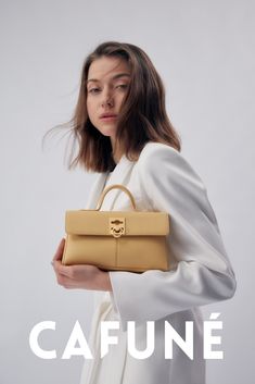 The Stance Wallet in Butter is making a stylish comeback. The bag is crafted in luxurious pebbled Italian cow leather, featuring an iconic C-Lock hardware which has been upgraded to stainless steel.  Highlight your spring outfit with this must-have spring wardrobe essential.

 #Cafune#Aesthetic#fashion#yellow#springoutfit
#Italianleather#stylish#yellowoutfit#springwardrobeessential Elegant Yellow Shoulder Bag With Top Carry Handle, Elegant Yellow Shoulder Bag With Top Handle, Luxury Handheld Shoulder Bag For Spring, Luxury Rectangular Satchel For Spring, Elegant Yellow Shoulder Bag With Detachable Handle, Luxury Top Handle Satchel For Spring, Luxury Satchel With Detachable Handle For Spring, Luxury Shoulder Bag With Detachable Strap For Spring, Luxury Spring Satchel