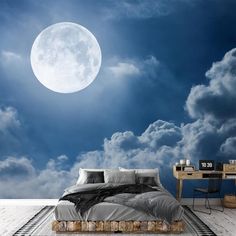 a bedroom with a full moon in the sky