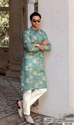 *PRODUCT DETAILS:- Offering a vibrant and eye-catching look, the sea green kurta set is adorned with a mesmerizing kaleidoscopic print. The design is further accentuated with an embellished placket and bandhgala collar, adding a touch of glamour to the traditional silhouette. Suitable for festive and cultural events, this printed kurta set can be styled with sleek silver jewellery and tan sandals to enhance its intricate patterns and rich colors. *FEATURES:- Color: Sea Green Fabric: 100% pure linen silk Design Type: Embroidery for kurta only Items Included:  (i)  Kurta ,                                (ii) Payjama (100% heavy tensile dyed) Wash Care: Dry Clean Only Disclaimer Text: Product color may slightly vary due to photographic lighting sources or your monitor/screen settings. Printed Kurta For Men, Sea Green Fabric, Silk Kurtas, Wedding Dresses Men Indian, Gents Kurta Design, Kurta For Men, Gents Kurta, Kurta Patterns, Kurta Men