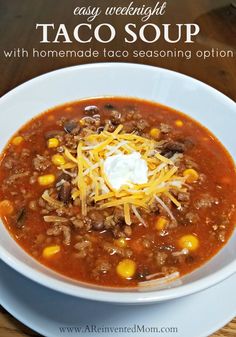 a white bowl filled with taco soup on top of a wooden table