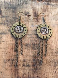 These are handmade Steampunk gear dangle earrings with bronze chain accents. Great Steampunk earrings for yourself or as a gift. * We ship Steampunk Earrings Diy, Steampunk Gold Dangle Jewelry, Steampunk Metal Earrings For Gift, Handmade Adjustable Steampunk Earrings, Nickel-free Silver Steampunk Earrings, Art Jewelry Necklace, Steampunk Brass Nickel-free Earrings, Punk Earrings