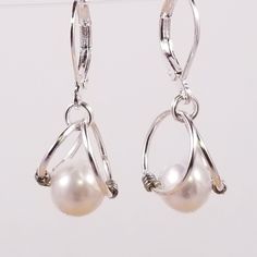 Women Glass White Pearl Silver Earring Wired Handmade Lightweight Leverback Delicate Hand Wired Glass Pearl Earrings Total Earring Measurement Little Over An Inch Long. Lots Of Colors Available - See Other Listings Great For Bridal. Edl1 White Teardrop Pearl Earrings, Formal White Hoop Earrings With Ear Wire, White Metal Teardrop Earrings With Pearl Drop, Elegant Adjustable White Wrap Earrings, Elegant White Adjustable Wrap Earrings, Pearl Silver Earrings, Artsy Accessories, Wired Glass, Silver Pearl Earrings