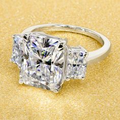 14K Gold 5ct Radiant-cut Moissanite Three-Stone Engagement Ring | Earthena Jewelry Bold Engagement Rings, Engagement Ring 3 Stone, Ring 3 Stone, Radiant Ring, Gold Moissanite Ring, Prong Ring, Bridal Engagement Rings, Three Stone Engagement, Engagement Ring Cuts