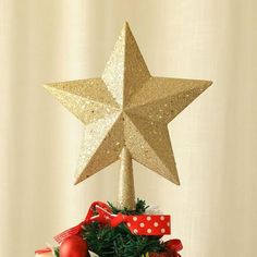 a christmas tree with a gold star on top